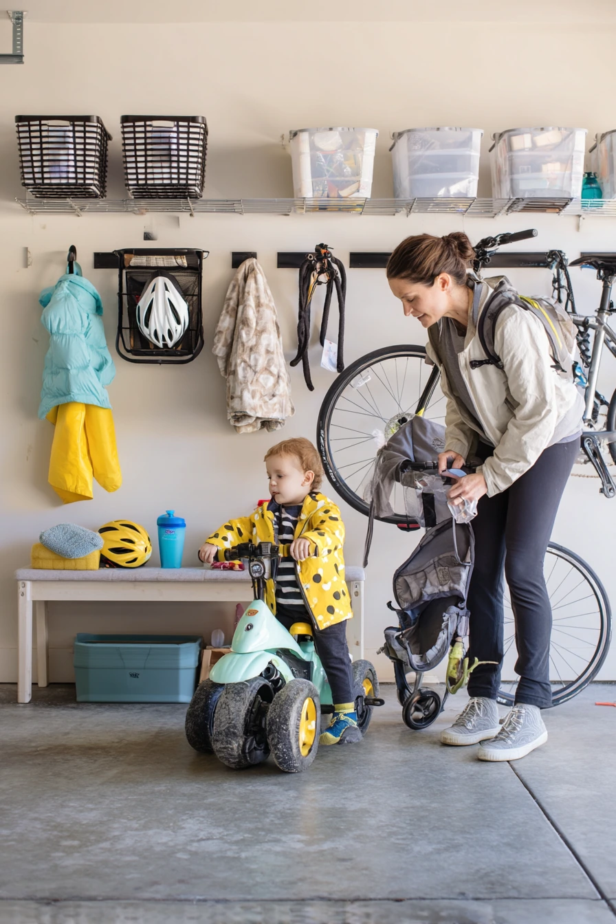Bike-and-stroller wall storage in a young family garage